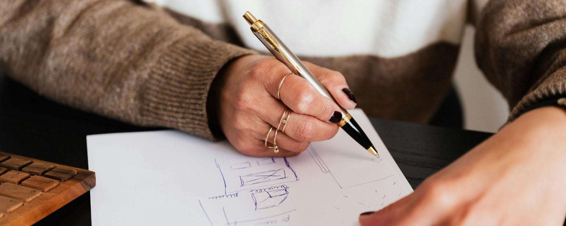 woman writing on a notebook