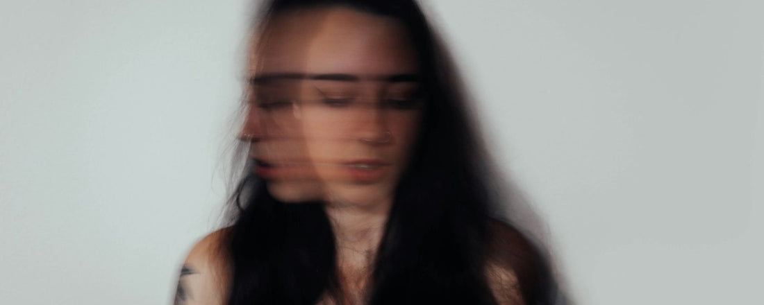 A woman closing her eyes