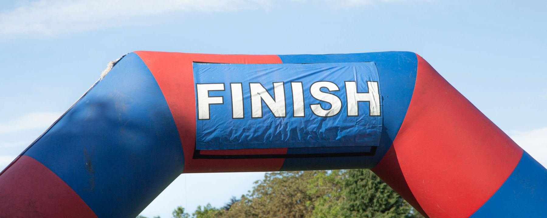 a large inflatable arch with the word finish on it