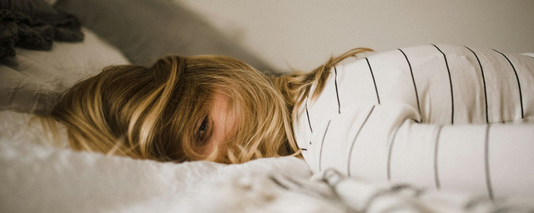 woman lying on bed